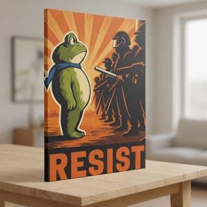 May include: A canvas print featuring a cartoon frog wearing a blue scarf, facing a line of silhouetted figures in riot gear. The background is orange with sunburst rays, and the word "RESIST" is printed in bold orange letters.