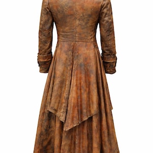 May include: A long, brown coat with a distressed, weathered texture. The coat features a structured collar, long sleeves with cuffs, and a flared, asymmetrical hemline that falls below the knees. The finish displays varied shades of brown.