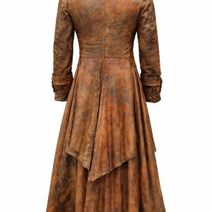 May include: A long, brown coat with a distressed, weathered texture. The coat features a structured collar, long sleeves with cuffs, and a flared, asymmetrical hemline that falls below the knees. The finish displays varied shades of brown.