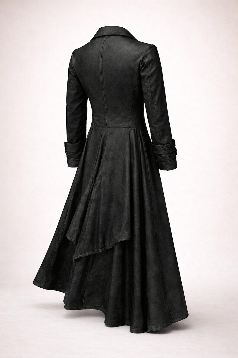 May include: A long, black coat with a flared skirt and a tailored fit. The coat features a notched collar, long sleeves with buttoned cuffs, and a back vent. The fabric appears to be a matte material, giving the coat a sleek, gothic aesthetic.