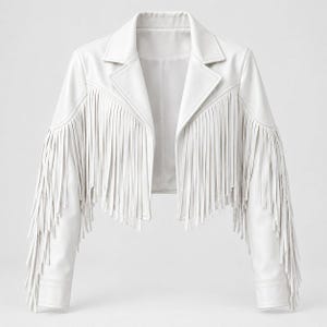 May include: A cropped white jacket featuring long fringe detailing across the chest, shoulders, and sleeves. The garment has a classic notched lapel collar, long sleeves with cuffs, and a straight hemline, all rendered in a solid white finish.
