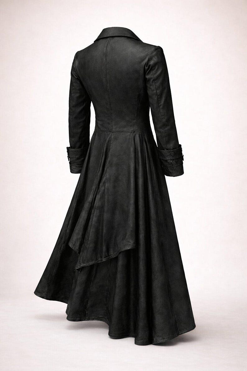 May include: A long, black coat with a flared skirt and a tailored fit. The coat features a notched collar, long sleeves with buttoned cuffs, and a back vent. The fabric appears to be leather or a leather-like material.