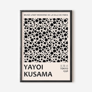 May include: Framed art print featuring a black and white polka dot pattern. The print includes the text "MUSÉE d'ART MODERNE DE LA VILLE DE PARIS" at the top, and "YAYOI KUSAMA" at the bottom, with Japanese text and "TOKYO 1998".