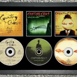 Counting Crows | August & Everything After | Recovering The Satellites | This Desert Life | Triple CD Wall Display | Frame Not Included |