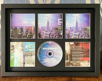 Oasis / Standing On The Shoulder Of Giants / Exhibidor de pared para CD de estilo retro / Marco no incluido /