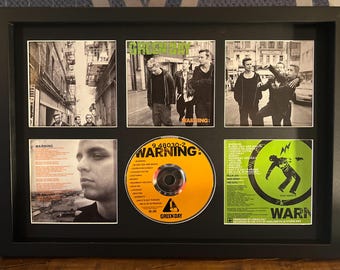 GREEN DAY/CADRE DISQUE D'OR/VINYLE, PHOTO ET LIVRET/EDITION LIMITEE/CERTIFICAT D'AUTHENTICITEINTERNATIONAL GREEN DAY/CADRE DISQUE D'OR/VINYLE, PHOTO ET LIVRET/EDITION LIMITEE/CERTIFICAT D'AUTHENTICITEINTERNATIONAL