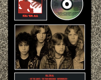 May include: A framed display featuring the Metallica album "Kill 'Em All." The display includes the album cover art, a CD, a band photo, and a tracklist. The album cover art shows a red hammer and blood. The CD is silver and green.