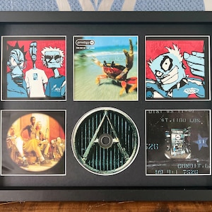 The Prodigy | The Fat Of The Land | Retro Mounted CD Wall Display | Frame Not Included |