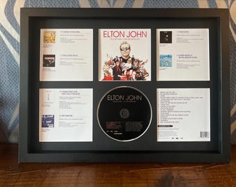 Elton John | Rocket Man : The Definitive Collection | Retro Mounted CD Wall Display | Frame Not Included |