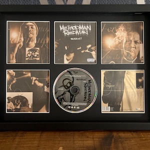 May include: Framed music album display featuring the album "Blackout!" by Method Man and Redman. The display includes the CD and several album art images in a black frame. The album art is in black and white.