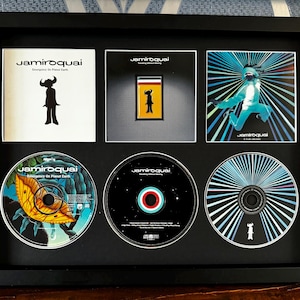 Jamiroquai | Emergency On Planet Earth | Travelling Without Moving | Funk Odyssey | Retro Triple CD Wall Display | Frame Not Included |