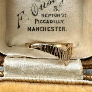 May include: A set of three ceramic mugs with a speckled, matte finish. Each mug features a different color: light blue, cream, and gray. The mugs have a simple, modern design and a comfortable handle.