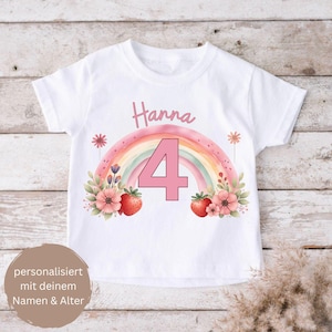 Puede incluir: Camiseta blanca con un diseño de arcoíris rosa, el número 4 y el nombre "Hanna". El diseño incluye fresas y flores. También está presente el texto "personalisiert mit deinem Namen & Alter".