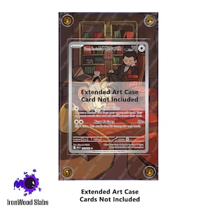 May include: An extended art case with a Pokemon card inside. The card features a cartoon illustration of a Meowth character. The case is displayed on a brown background with the text "IronWood Slabs".