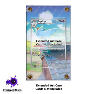 May include: Clear acrylic extended art case for a trading card. The case features gold-colored corner screws and the text "Togekiss" on the card inside. The case is designed to protect and display trading cards.
