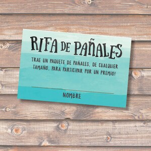 May include: A blue and green raffle ticket with the text "RIFA DE PAÑALES" in black. The text below reads "TRAE UN PAQUETE DE PAÑALES, DE CUALQUIER TAMAÑO, PARA PARTICIPAR POR UN PREMIO!" and "NOMBRE".