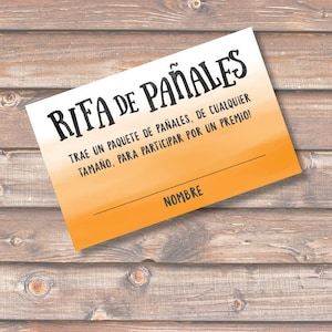 May include: A bright orange and white raffle ticket with the text "RIFA DE PAÑALES" in black. The text below reads "TRAE UN PAQUETE DE PAÑALES, DE CUALQUIER TAMAÑO, PARA PARTICIPAR POR UN PREMIO!" and "NOMBRE" at the bottom.