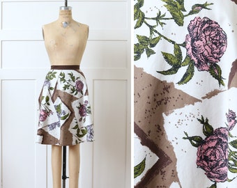 vintage 1950s rose print apron • Alex Colman fabric print of floral seed pack with rhinestones on polished cotton