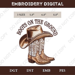 May include: Digital embroidery design showing a cowboy hat and boots with the text "Boots on the Ground." The design includes sizes 14.7 cm, 17.3 cm, and 22.4 cm. The image is in brown and white, ideal for country-themed projects.
