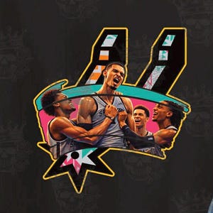 May include: Black t-shirt featuring a colorful graphic of basketball players celebrating. The design includes the team's logo and a stylized representation of the players in action. The shirt is made of a soft material.