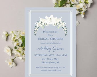 May include: A light blue bridal shower invitation with white floral accents. The invitation includes the text "Please join us for a BRIDAL SHOWER honoring the bride to be Ashley Green." Details include the date, time, and location.