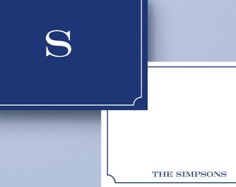 May include: A navy blue card with a white border and the letter "S" in white. Below, a white card with a white border and the text "THE SIMPSONS" in navy blue.