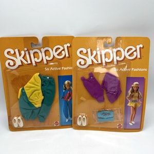 May include: Two vintage Skipper doll fashion sets on original packaging. One set features a yellow and teal jumpsuit with white shoes. The other set includes a purple top and skirt, a blue bag, and white shoes. The packaging reads "Skipper So Active Fashions."