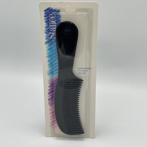 May include: Black plastic comb with a curved handle. The packaging says "Unbreakable" and "For wet or dry hair".