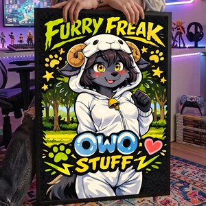 May include: A framed artwork featuring a cartoon character in a white hooded outfit with a sheep-like design. The artwork has the words "FURRY FREAK" and "OWO STUFF" in a vibrant, eye-catching style. The background includes trees and stars.