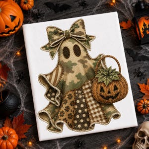May include: A white canvas featuring a ghost illustration with a camouflage pattern, a large bow on its head, and a brown pumpkin basket. The ghost has dark oval eyes and is decorated with patchwork sections of floral, polka dot, and plaid patterns.