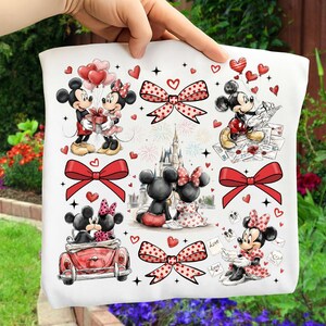 May include: White fabric featuring Mickey and Minnie Mouse in various romantic scenes. The design includes red bows, hearts, and the word "Love" on some elements. The overall theme is a celebration of love and romance.