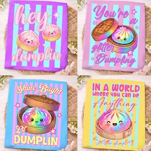May include: Four colorful tote bags with dumpling designs. Each bag features a different phrase: "Hey Dumplin", "You're a Glitter Dumpling", "Shine Bright Lil Dumplin", and "In a World Where You Can Be Anything, Be Glitter Dumpling".