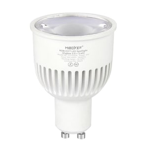Puede incluir: Un foco LED blanco con una carcasa de plástico blanco y una lente de vidrio transparente. El foco está etiquetado como "MIBOXER RGB+CCT LED Spotlight (Zigbee 3.0 + 2.4G)" y tiene el número de modelo "FUT106ZR".