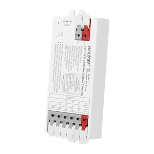 Puede incluir: Controlador LED Zigbee 3.0+2.4G blanco con una carcasa de plástico blanco y terminales de cableado rojos y grises. El controlador tiene un botón negro etiquetado como "SET" y una entrada negra etiquetada como "INPUT". El texto "MIBOXER® Mi-Light Subordinate New Brand" está impreso en la parte frontal del controlador.