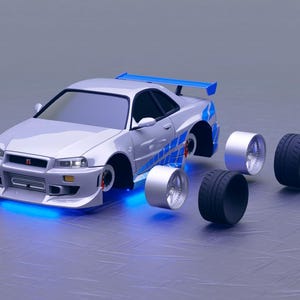 Può includere: Un'auto sportiva argentata con dettagli blu e uno spoiler posteriore, con ruote e pneumatici staccati. L'auto ha un profilo ribassato e un paraurti anteriore con una luce blu. Le ruote sono argentate e i pneumatici sono neri.