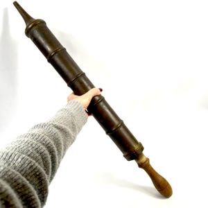 Brass hand pump with wooden handle – early 20th century industrial tool