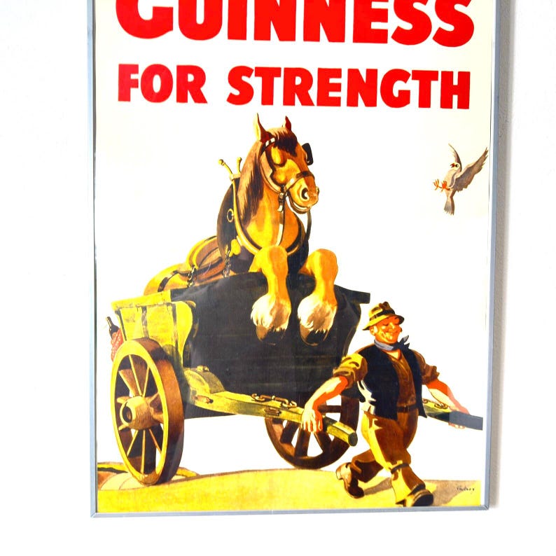May include: Vintage Guinness advertisement poster featuring a horse-drawn cart with the text "GUINNESS FOR STRENGTH" in red. A man in a hat runs alongside the cart, and a bird flies in the background. The poster has a white background.