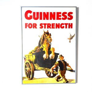 May include: Vintage Guinness advertisement poster with the text "GUINNESS FOR STRENGTH" in red. The image features a horse-drawn cart, a man, and a bird, all in a classic illustration style. The poster is framed.