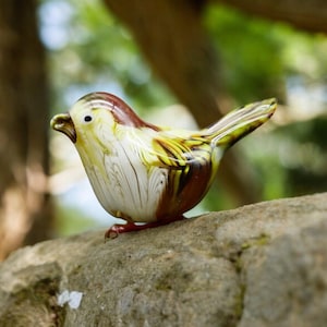 Vintage glass bird figurine brown yellow and white ornament in murano style.