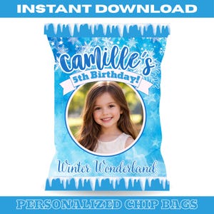 May include: A personalized chip bag with a winter wonderland theme. The bag features a photo of a young girl, the text "Camille's 5th Birthday!", and the words "Winter Wonderland" in a blue and white design.