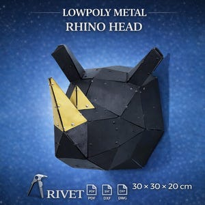 May include: A geometric, low-poly metal rhino head sculpture. The rhino head is black with gold-colored horns. The dimensions are 30 x 30 x 20 cm, or approximately 11.8 x 11.8 x 7.9 inches. The word "RIVET" is printed at the bottom.