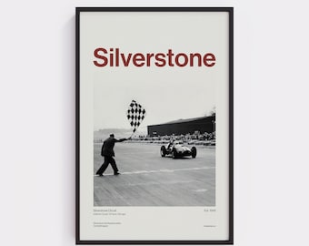 May include: Framed black and white print featuring a vintage race car at Silverstone Circuit. The word "Silverstone" is displayed in maroon at the top. A checkered flag is being waved. The print includes text at the bottom.