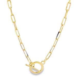 May include: A gold chain necklace with a toggle clasp. The chain is made of oval-shaped links.
