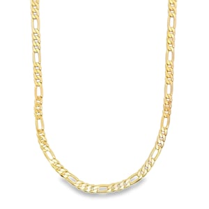 May include: A gold-colored Figaro chain necklace. The necklace features a pattern of elongated links alternating with two or three shorter links. The chain is displayed against a white background.