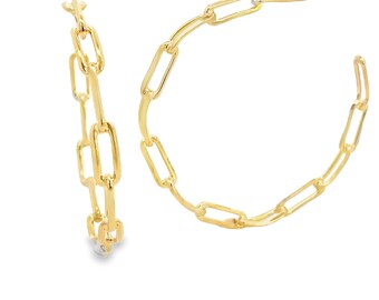 May include: A pair of gold-colored hoop earrings. Each earring is made of a chain link design. The earrings are on a white background.