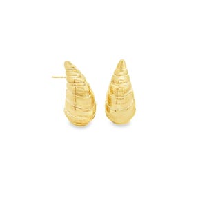 May include: A pair of gold-colored stud earrings. Each earring is shaped like a spiral cone with a textured surface. The earrings are set against a white background.