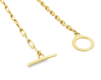 May include: A gold chain necklace with a toggle clasp and a circular ring at the end.