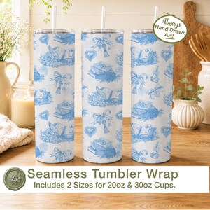 May include: Three cylindrical tumblers with a white background and a repeating blue pattern featuring open books, quill pens, envelopes, bows, and hearts. Each tumbler includes a clear straw and a lid. The text Always Hand Drawn Art is visible.