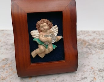 Pequeño marco de madera con ángel pintado a mano.