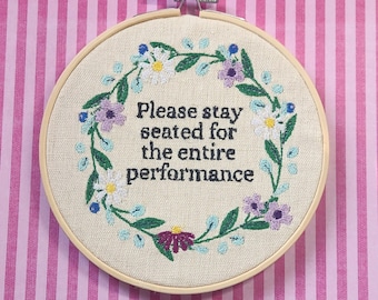 Please stay seated for the entire performance, please remain seated, funny bathroom embroidery, bathroom embroidery art, finished embroidery